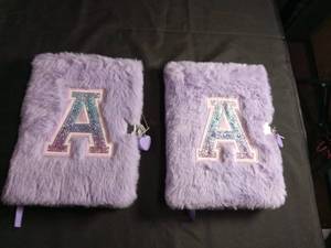 lot 1077 image: Purple Plush Letter A Diary with Heart Charm