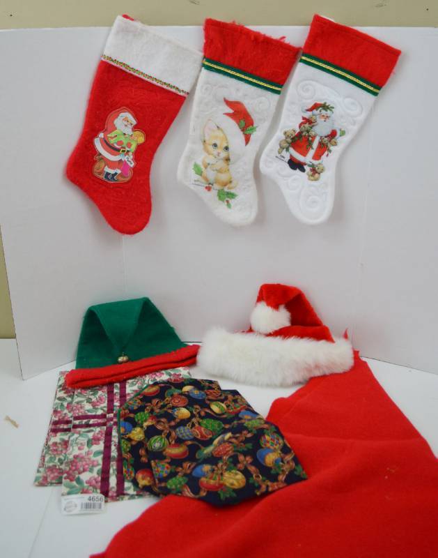 lot 4656 image: Christmas Stockings, Felt Tree skirt, Hats and Placemats