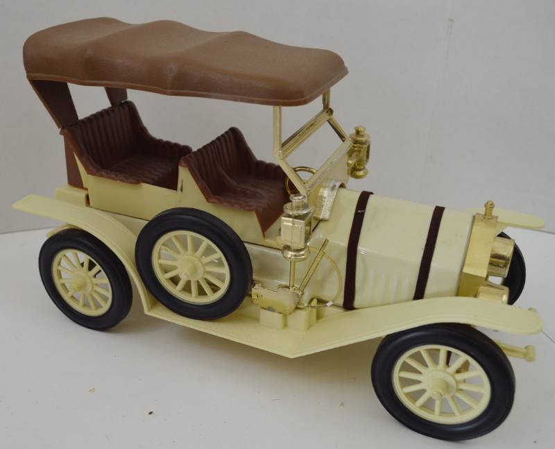 lot 4691 image: Jim Beam 1909 Thomas Flyer Decanter has Broken Steering Wheel (Seal is Intact, Selling as Bottle Only, No Guarantees On Contents)