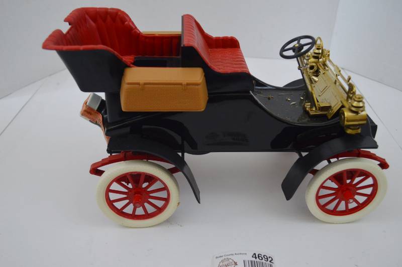 lot 4692 image: Jim Beam 1903 Cadillac Decanter (Seal is Intact, Selling as Bottle Only, No Guarantees On Contents)