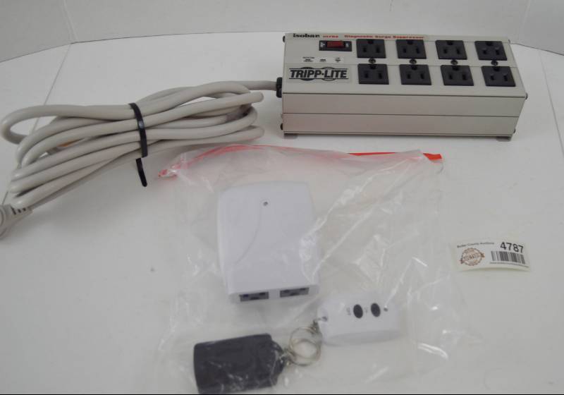 lot 4787 image: Tripp-Lite Surge Protector Power Strip and Remote Control Outlet W 2 Remotes (Black Remote Did Not Work). Works