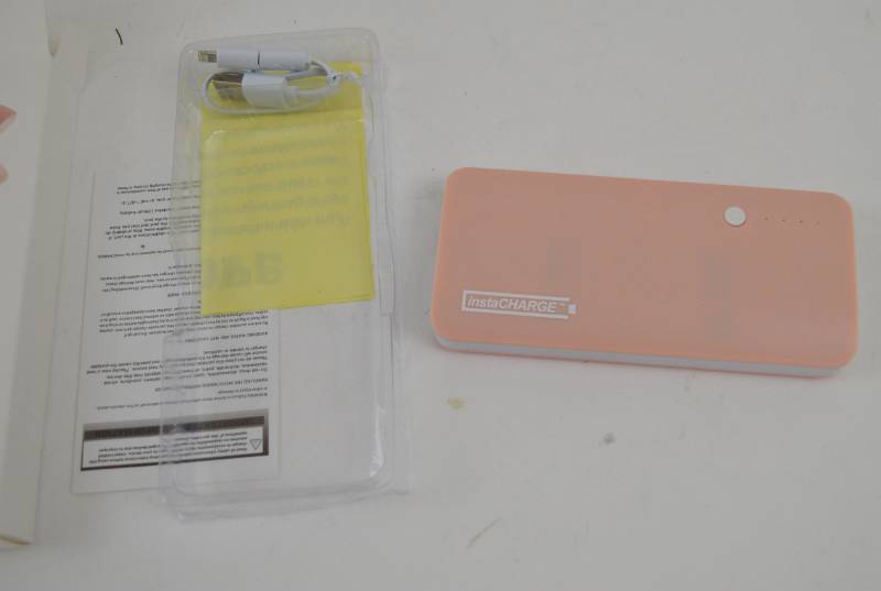 lot 4803 image: InstaCharge Portable Charger Pink (Plugged Into Computer, Lights Come On)