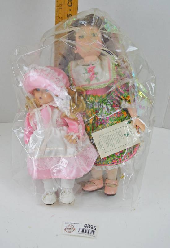lot 4895 image: 2 Porcelain Dolls w Plastic Protector
