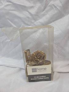 lot 802 image: JCPenney Home Collection Gold Shower Curtain Hooks