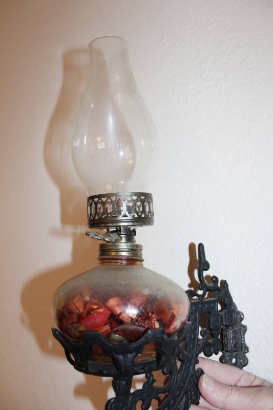 lot 1114 image: Oil Lamp With Cast Iron Wall Sconce