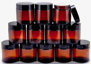 lot 2187 image: Vivaplex, 12, Amber, 4 oz, Round Glass Jars, with Inner Liners and black Lids