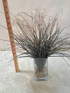 lot 50 image: Modern Artificial Grass Arrangement with Pink Flowers