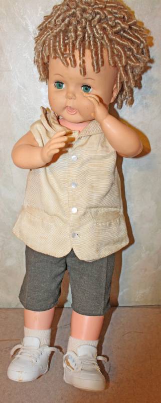lot 1555 image: Girl Doll With Curly Brown Hair - Approximately 27 Inches Tall