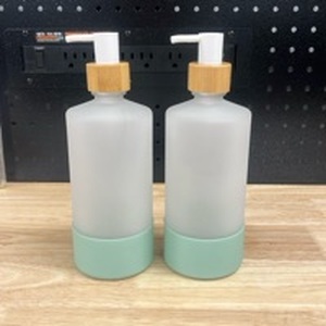 lot 3244 image: 2- Glass Soap Pumps. Refillable  - Retail $0