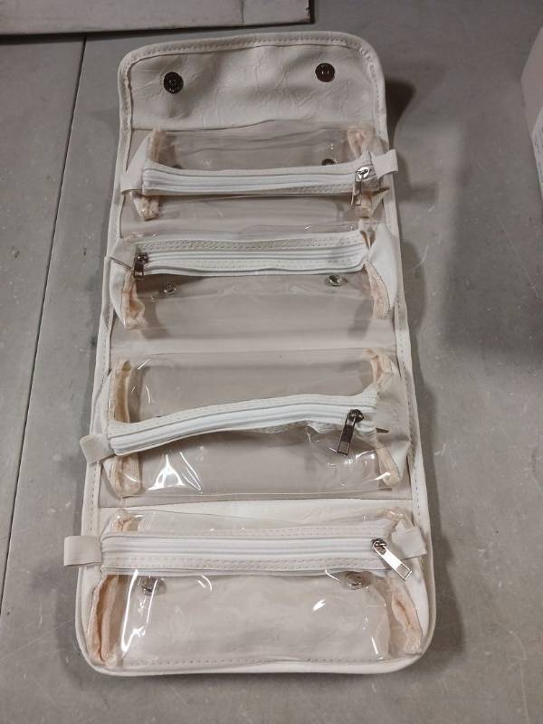 lot 44591 image: White Roll-Up Travel Organizer