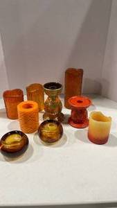 lot 1065 image: Orange candles and candle holders