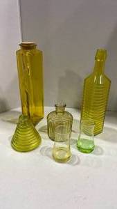 lot 1068 image: Yellow glass bottles  vases