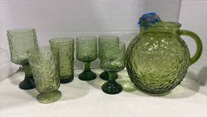 lot 1109 image: Vintage Green Glass Pitcher and Goblet Set. Pitcher is broken