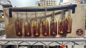 lot 1169 image: Amber Glass Bottle LED Wall Sconce Set