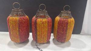 lot 1184 image: Boho orange-red beaded wire tea light candle holders set of 3