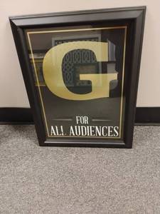 lot 1833 image: Wall Decor.  Framed Movie Rating G.  18 x 14.5