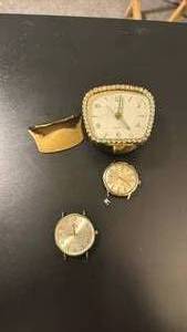 lot 1914 image: Elgin alarm clock, and watch faces