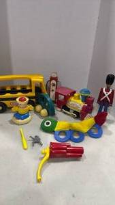 lot 2026 image: 1960s Fisher Price train engine and other toys