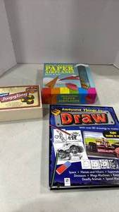 lot 2036 image: Paper airplane kit, drawing book and learn to juggle