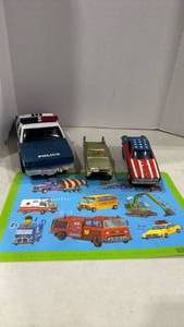 lot 2054 image: 1960s Corgi Police Car and other vintage cars and car placemat