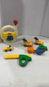 lot 2055 image: Fisher Price ruler, playskool radio and construction cars