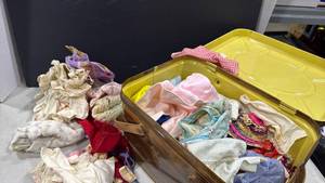 lot 2102 image: Faux wood grain metal picnic basket with Doll clothes