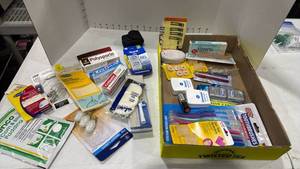 lot 2283 image: Toothbrushes, first aid and hair products