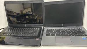 lot 6014 image: Laptops by HP. One has broken screen and other has a missing back. Sold as is