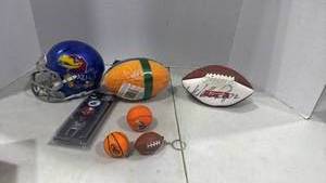 lot 6097 image: Signed mini football, small KU helmet and more