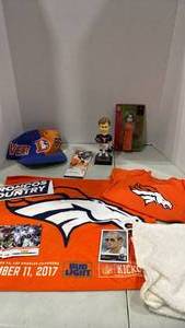 lot 6105 image: Bronco bobble head of Elway, ticket from game, bay onesie and more