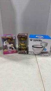 lot 6116 image: Toilet coffee mug, bumblebee bobble head and my little pony 25th birthday celebration