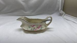 lot 10 image: Homer Laughlin Floral Gravy Boat