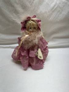 lot 32 image: Musical Porcelain Ballerina Doll in Pink Lace Dress