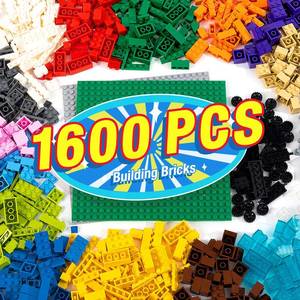 lot 412 image: MANNIDOO 1600 Pieces Building Bricks, Building Bulk Block with 2 Packs 24x24 Studs Sticky Plate and 46PCS Wheel Accessory - Compatible with All Major Bricks, Gfits for Kid - 18 Shape16 Colo - Retail $31