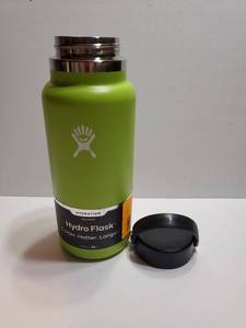 lot 61781 image: Hydro Flask Water Bottle - Insulated Stainless Steel - Wide Mouth Flex Lid, Non Spill, Leakproof and Refillable in 32 Oz. SCUFFS with Dent on Bottom. - Retail $40