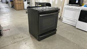 lot 20 image: Black GE Electric Range with Glass Cooktop - Retail $1,300