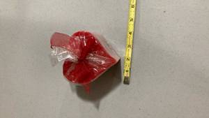 lot 2070 image: Red and White Striped candle heart shaped