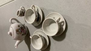 lot 2237 image: Miniature White Porcelain Tea Set with Character Design