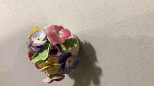 lot 2300 image: Porcelain Pansy Flower Arrangement