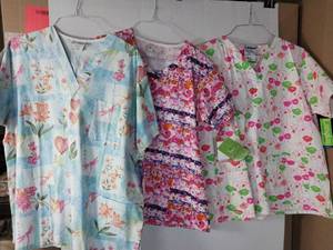 lot 66539 image: APPEARS NEW - 1 Peaches, 1 Bio, & 1 Landau Floral Pattern Medical Scrub Tops (Size Large) Lot of 3