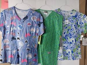 lot 66585 image: APPEARS NEW - 1 Landau, 1 Scrub Zone,1 Med Couture Medical Scrub Tops (Size XS) Lot of 3