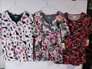 lot 66642 image: APPEARS NEW - Landau & Koi Floral Print Medical Scrub Tops Bundle (Size XL) 3 Pack