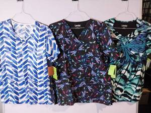 lot 66809 image: APPEARS NEW - Landau & BIO  Medical Scrub Tops Bundle - Dragonfly and Geometric Patterns (Size Medium) 3 Pack