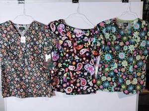 lot 66812 image: APPEARS NEW - Koi & Peaches Colorful Printed Medical Scrub Tops Set (Size XS) 3 Pack