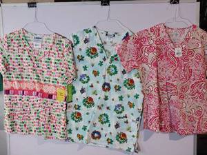 lot 66852 image: APPEARS NEW - Landau & Med Couture Medical Scrub Top Bundle - Holiday and Floral Patterns (Size XS) 3 Pack