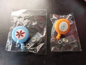 lot 66883 image: APPEARS NEW - Medical & Floral Clip-On Retractable Badge Reel Set (Includes 2)