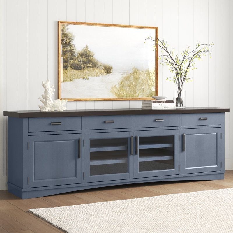 lot 3563002 image: Bankhead TV Stand for TVs up to 88 - Blue (See pictures) - Retail $1,349