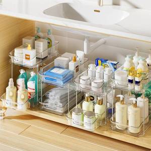lot 48614 image: Delamu 2-Tier Under Sink Organizers and Storage, Multi-Purpose Stackable Bathroom Cabinet Organizers, Pull Out Kitchen Pantry Organization and Storage with Dividers(4 Pack, Clear) - Retail $50