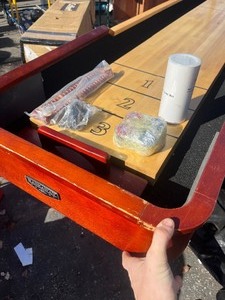 lot 24 image: 10 Shuffle Board - Great for any Gameroom - Unique Project, Occasional Shipping blemishes, no Legs included - Comes with speed wax, Pucks, scorekeepers - Bid accordingly still playable , make your own Base Legs