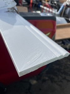 lot 168 image: 5-14 in. x 58 in. x 96 in. Baseboard White Prepainted Waterproof Colonial PVC Moulding - 1 Piece